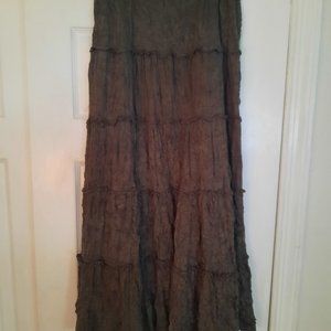 Women's long green skirt with ruffles between panels